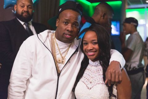 Yo Gotti poses a picture with De'arra Taylor.